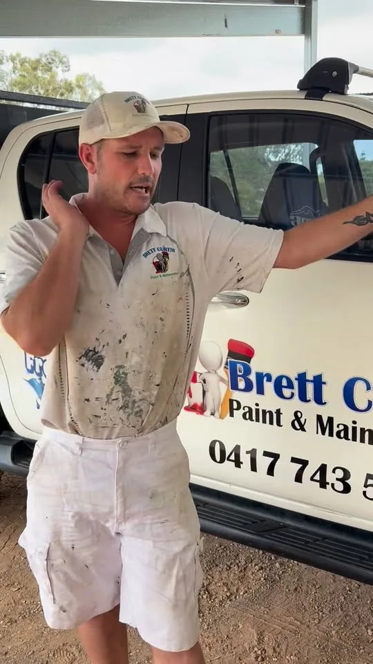 Brett Curtis beside his branded work ute