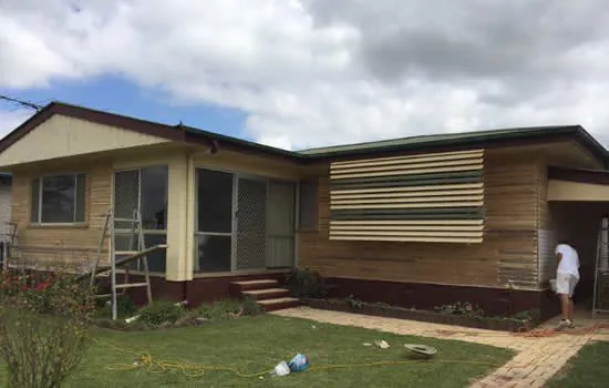 Weatherboard house mid repaint